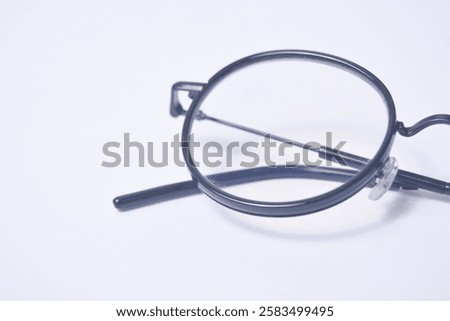 Black frame glasses with normal blueray lenses on a white background
