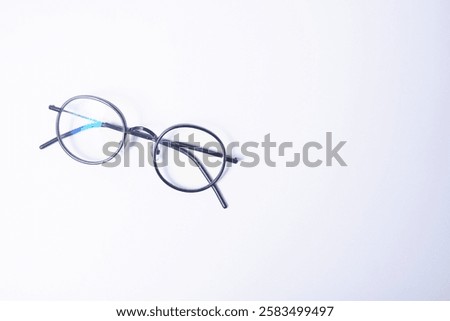 Black frame glasses with normal blueray lenses on a white background