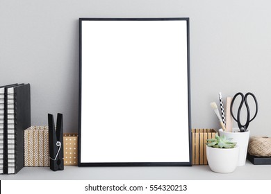 Black Frame Mock Up On Gray Background, Office Supplies, Stylish Scissors, Small Plant. Arranagement Inspiration.