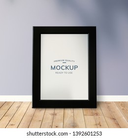 Black Frame Mockup Against A Wall