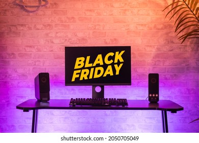 Black Friday Background With Computer Gamer Workspace With Black Screen Monitor With Neons And Colorful Lights. Gamer Rig.