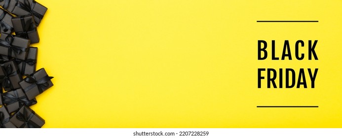Black Friday banner. Black gift boxes with black ribbons on bright rich yellow background. Black friday sale, discount, shopping concept - Powered by Shutterstock