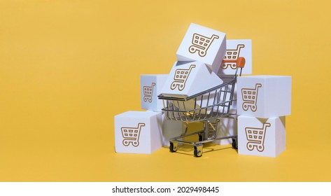 black friday concept, white box parcel on trolley on yellow background. shopping online and service home delivery. 