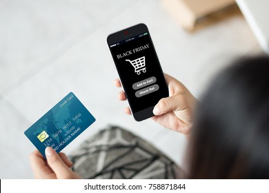 Black Friday Online Shopping Concept.hands Using Mobile Phone And Holding Credit Card