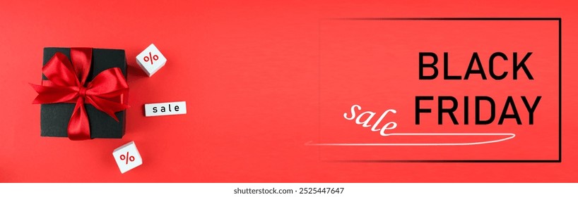 Black Friday sale banner. Black gift box with red satin ribbon on red background. Copy space. - Powered by Shutterstock