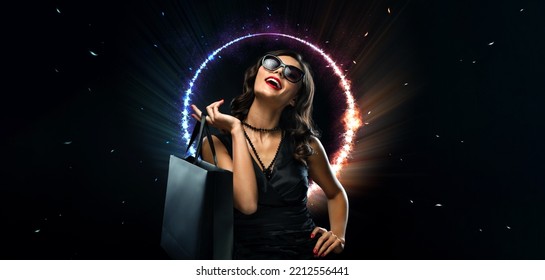 Black friday sale concept. Shopping woman holding grey bag isolated on dark background in holiday. Neon lights. - Shutterstock ID 2212556441
