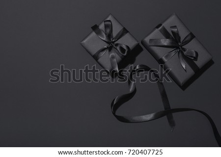 Black Friday sale flat lay with presents and ribbon in heart shape