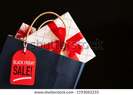 Black Friday Sale shopping bag and gifts boxes with message tag. shopping concept.