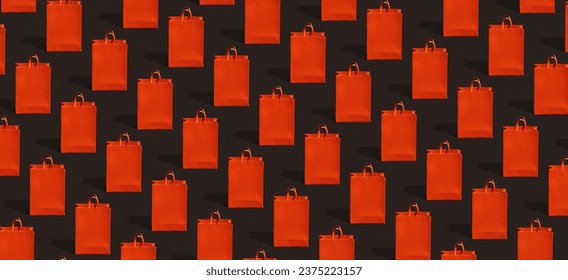 Black friday sale, shopping concept. Red paper shopping bag pattern on black background - Powered by Shutterstock