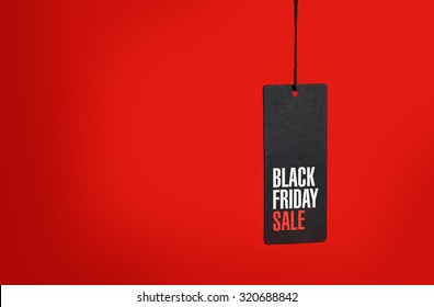 Black friday. Sale tag on the red background - Shutterstock ID 320688842