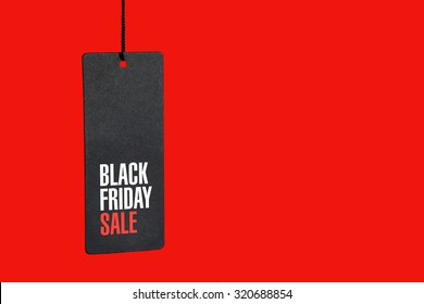 Black friday. Sale tag on the red background - Shutterstock ID 320688854