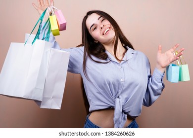 black friday, seasonal sale, holidays, discount program. young happy woman holding many shopping bags with goods