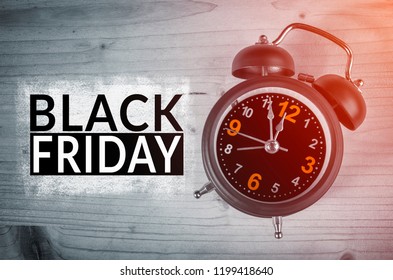 Black Friday text with old analog clock. Black Friday sale concept.