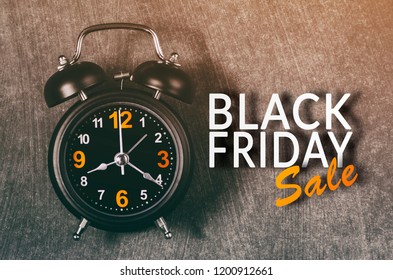 Black Friday text with old analog clock. Black Friday sale concept.