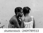 Black friends gather for an evening hangout and catch up in the yard on a summer