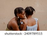 Black friends gather for an evening hangout and catch up in the yard on a summer