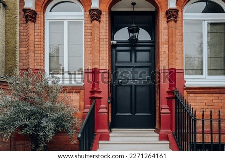 Black front door of a traditional house in Kensington and Chelsea, West London, UK. ストックフォト © 