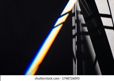 Black futuristic shadows and bright light refraction glow effect with colorful rainbow. Black noir future tech stylish background. Modern dark abstract art backdrop. design template for any purposes.