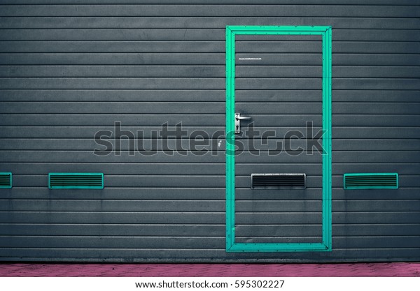 Black garage gate\
with ventilation grilles. Large automatic up and over garage door\
with inclusion of smaller personal door. Funny colorise. Multicolor\
background set
