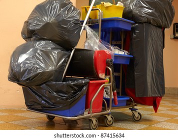 Black garbage bags on janitor cart