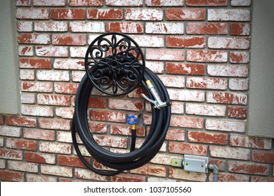 Black Garden Hose On Holder