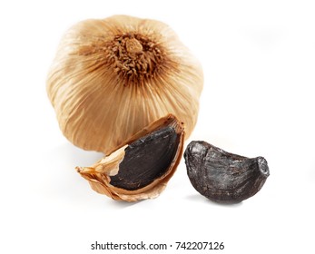 black garlic isolated on white