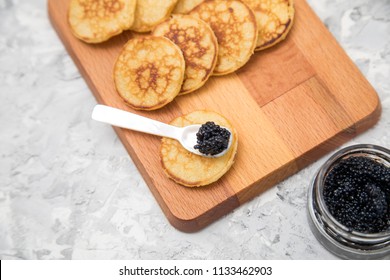 Black German Caviar On Pearl Spoon With Blinis