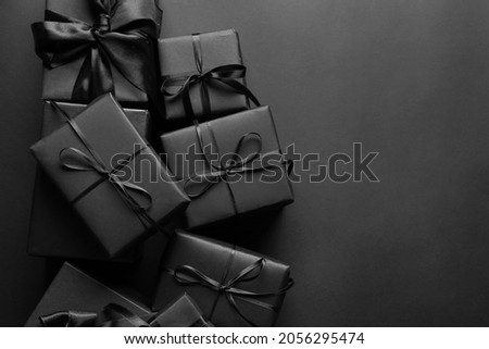 Black gift boxes on dark background