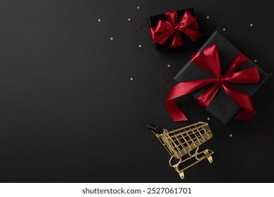 Black gift boxes with red ribbons and miniature shopping cart on a dark background symbolize Black Friday sales and shopping excitement - Powered by Shutterstock