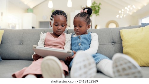 Black girl children, tablet on sofa and online with elearning or watching cartoon movie, sisters at home and screen time. Young female kids, streaming and subscription to education app or film - Powered by Shutterstock