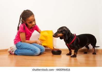 Black Girl Feed Her Dog Pet With Food