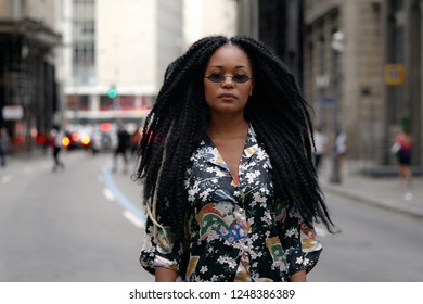 Black Girl Magic in a Blurred Street Traffic Background - Powered by Shutterstock