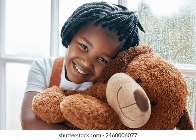 Black girl, portrait and teddy bear in house by window for happy, wellness and playing with toys. Homeless child, smile and stuffed animal in orphanage or children home for love, friendship and hug - Powered by Shutterstock