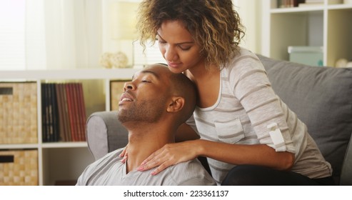 Black Girlfriend Giving Boyfriend Neck Massage