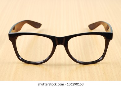 black glasses on wood  background