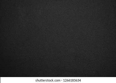Black glitter background with tiny rough grain textured, Sandpaper texture abstract background.