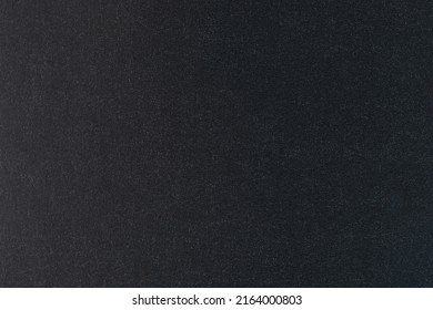 Black glossy paper texture surface macro close up view