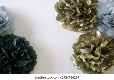 Black, Gold And Blue Poms On White Background. Celebration Decor Concept