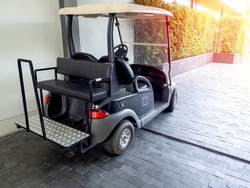Black Golf Cart Or Golf Buggy Car Parking In The Hotel Service For Customer.