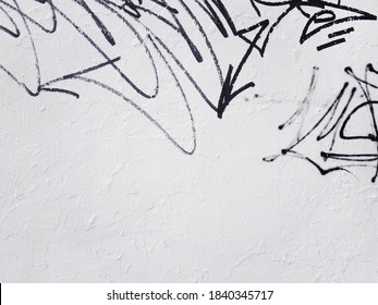 Black graffiti sign on white wall in urban city. Painting on plaster on concrete stucco clean wall. Dirty abandoned art on building. Conceptual image with copy space for text or design. - Powered by Shutterstock