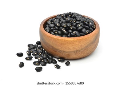  Black gram (Vigna mungo) in wooden bowl isolated on white background. 