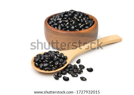  Black gram (Vigna mungo) in wooden bowl and spoon isolated on white background. 