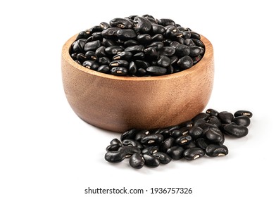Black gram(Vigna mungo) in wooden bowl isolated on white background.