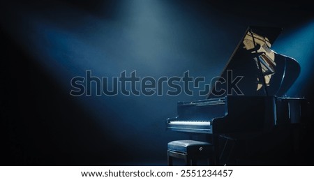 Black Grand Piano with a Microphone Standing on a Concert Stage Under Spotlights. Music Instrument Ready to Be Used by an Extravagant Music Artist and Singer