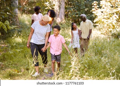 Black Grandma Walking With Grandson And Family, Full Length