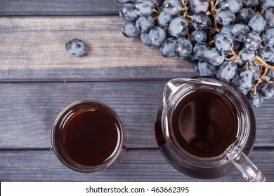black grapes and juice in the jug top view
