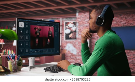 Black graphic designer working in loft with AI image generator software. Digital screen displaying visuals created through machine learning and cloud computing, generative AI. Camera B.
