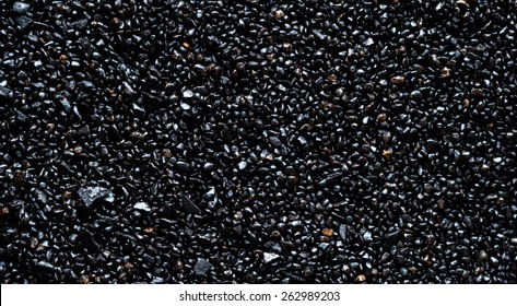 Black Gravel Background With Reflection,Top View Shot.