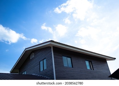 Black gray backyard corner and bright sky