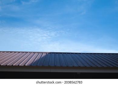 Black gray backyard corner and bright sky